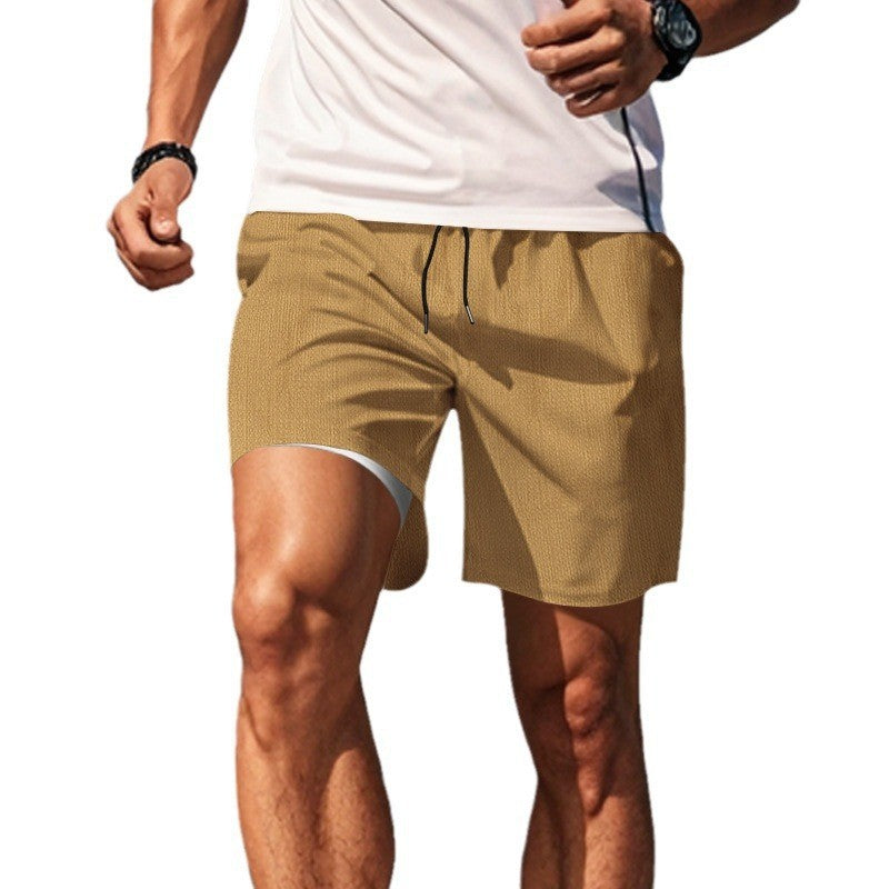 Men's two-layer swim shorts with integrated compression inner shorts and hidden cell phone pocket StylebySassy