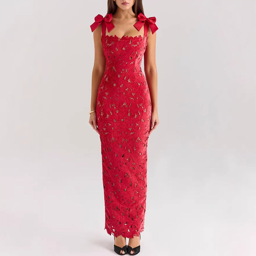 Women's form-fitting floor-length lace evening dress in column shape with decorative bow straps StylebySassy