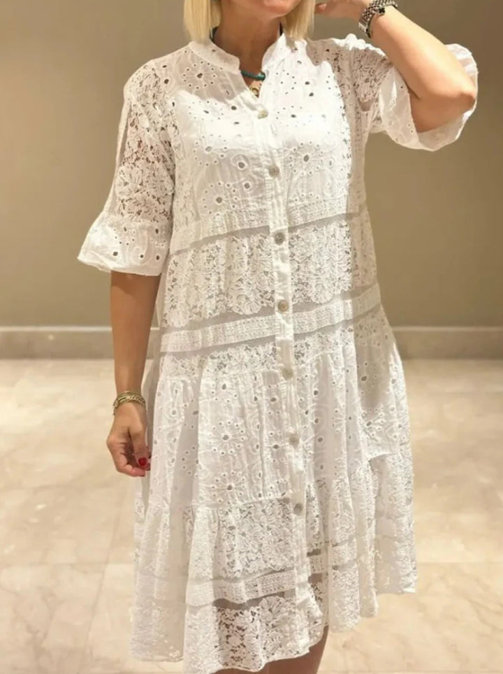 Women's romantic midi dress with broderie anglaise, buttoned top, stand-up collar, half-length flounce sleeves, and tiered hem StylebySassy