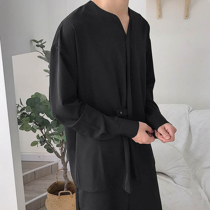 Men's loosely cut V-neck shirt with concealed button placket and band closure StylebySassy