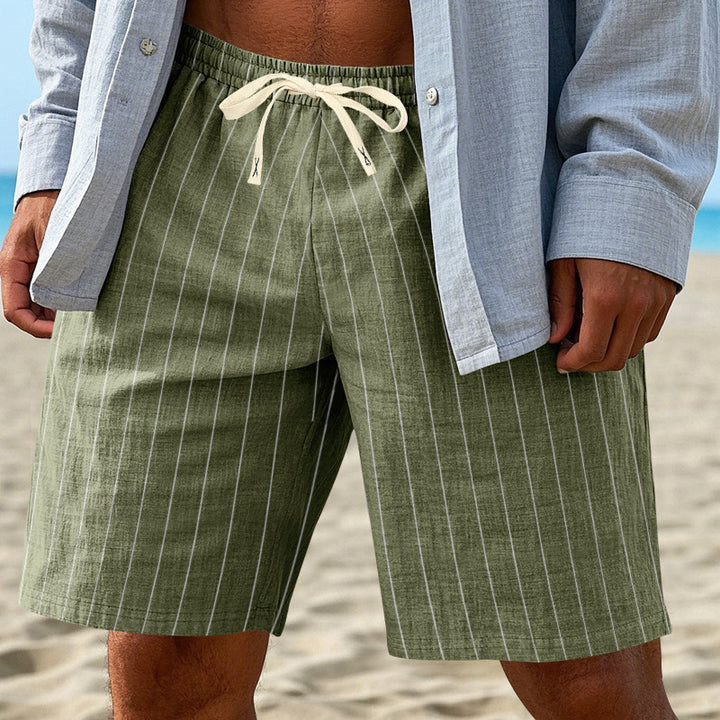 Men's relaxed beach Bermuda shorts with fine pinstripe structure, elastic drawstring waistband, and side slip pockets StylebySassy