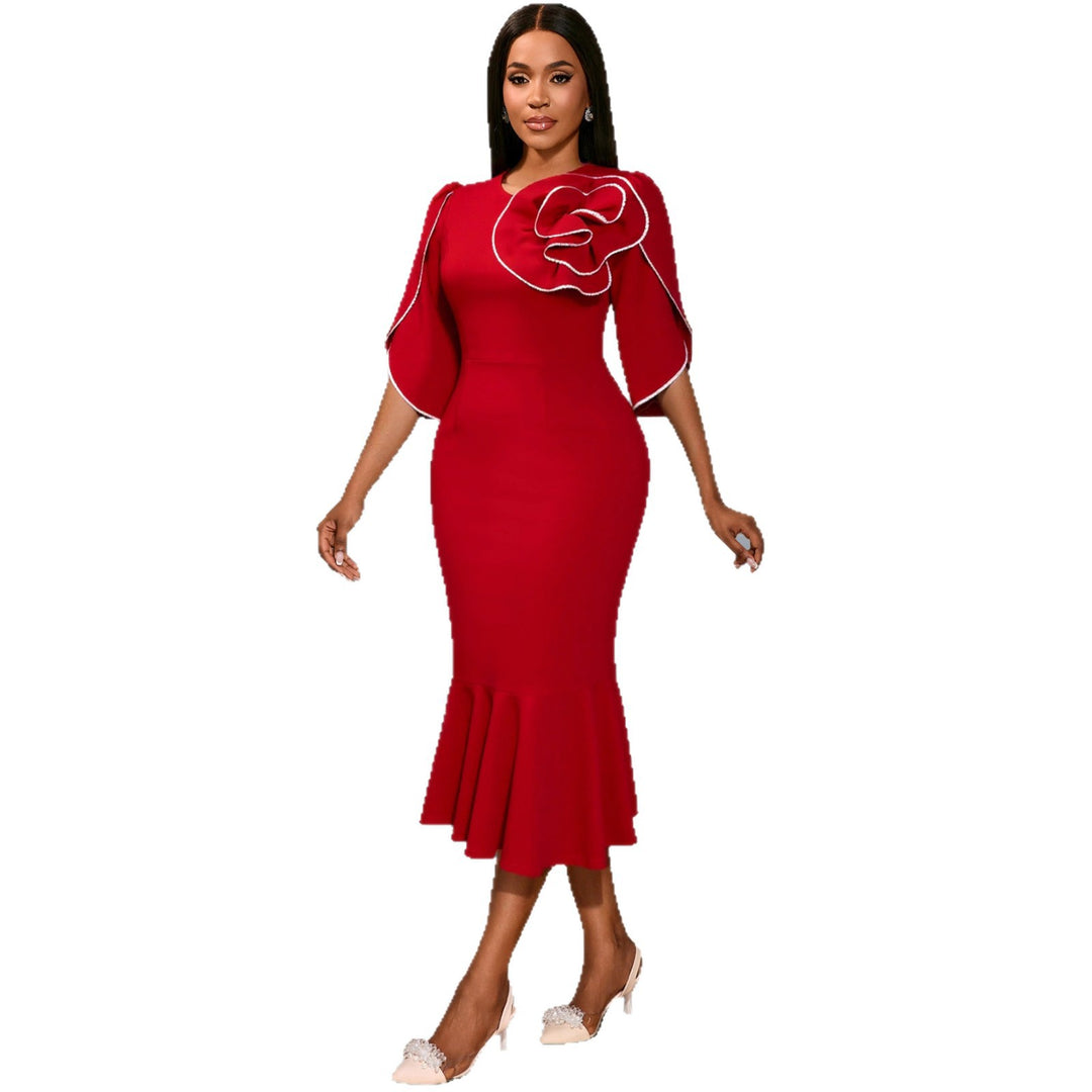 Ladies fitted evening dress with peplum and voluminous ruffle design StylebySassy