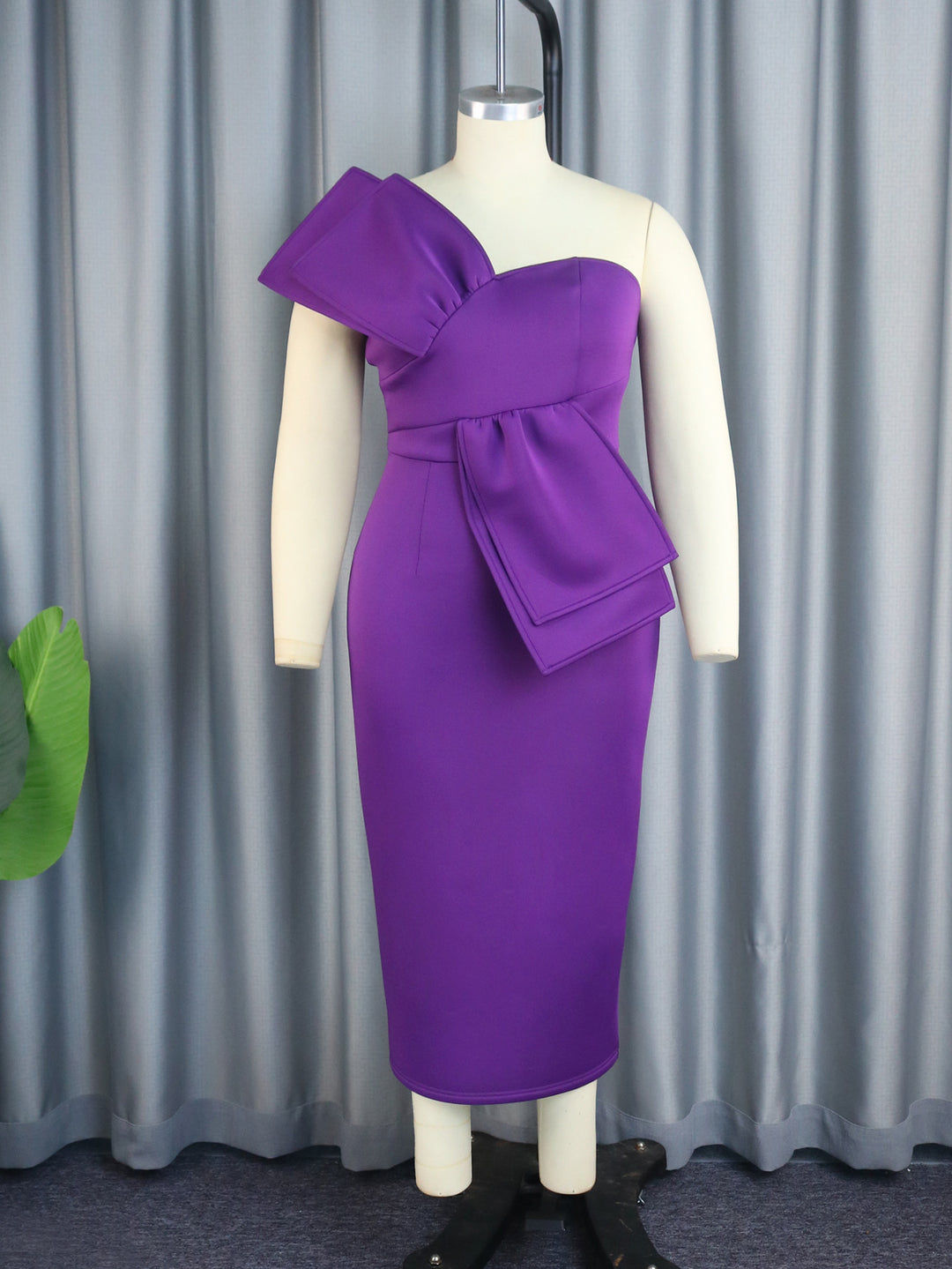 Women's sheath dress with asymmetrical design and voluminous bow detail StylebySassy