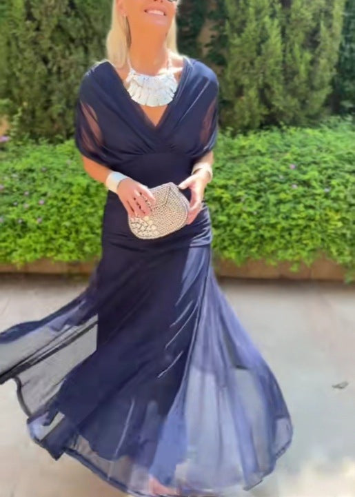 Ladies elegant floor-length evening dress with draped shoulder area and airy chiffon skirt StylebySassy