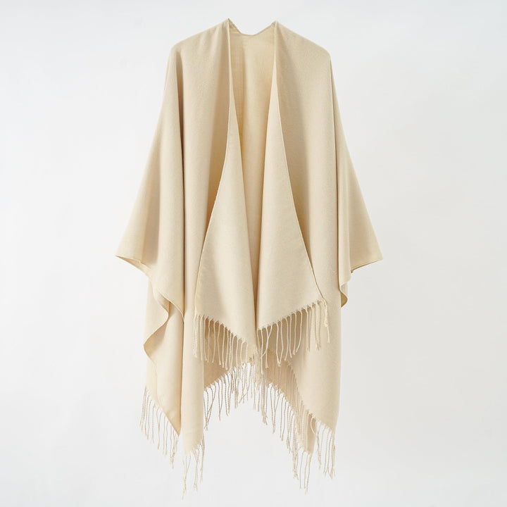 Women's fashionable fringe poncho made of soft material with luxurious drape StylebySassy