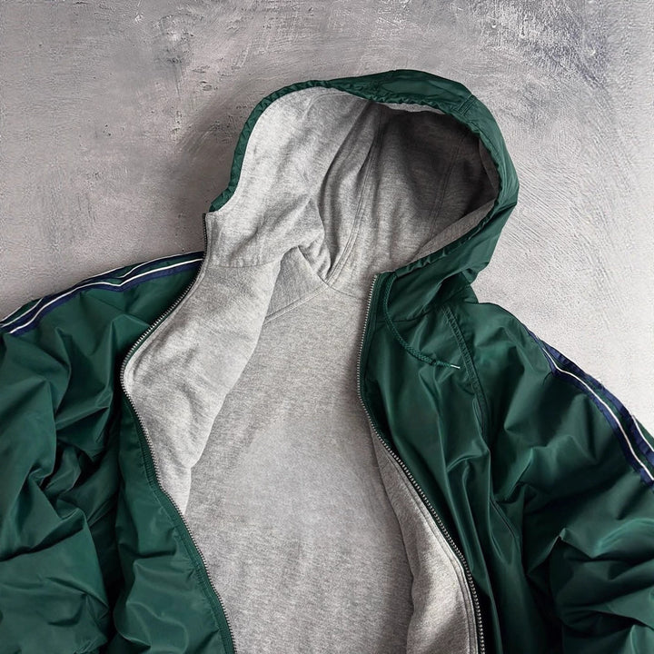 Unisex non-fitted windbreaker with hood padded fleece lining drawstring hem and decorative stripes on sleeves StylebySassy