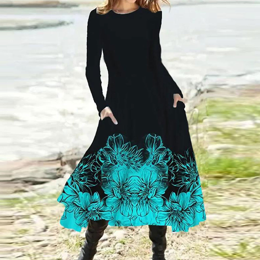 Women's flowing maxi dress with tie-dye circle pattern, round neckline, waist seam, and side pockets StylebySassy