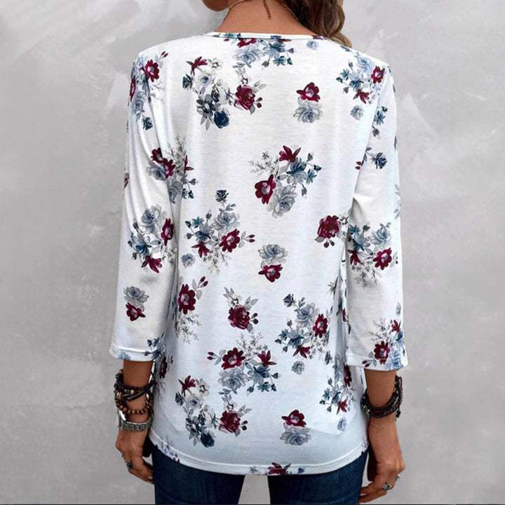 Women's floral tunic blouse with pleats and decorative button placket StylebySassy