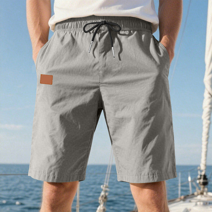 Men's quick-drying swim shorts in Bermuda cut with elastic waistband and drawstring StylebySassy