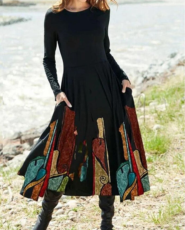 Women's A-line midi dress with abstract spray pattern, round neckline, long sleeves and side pockets StylebySassy