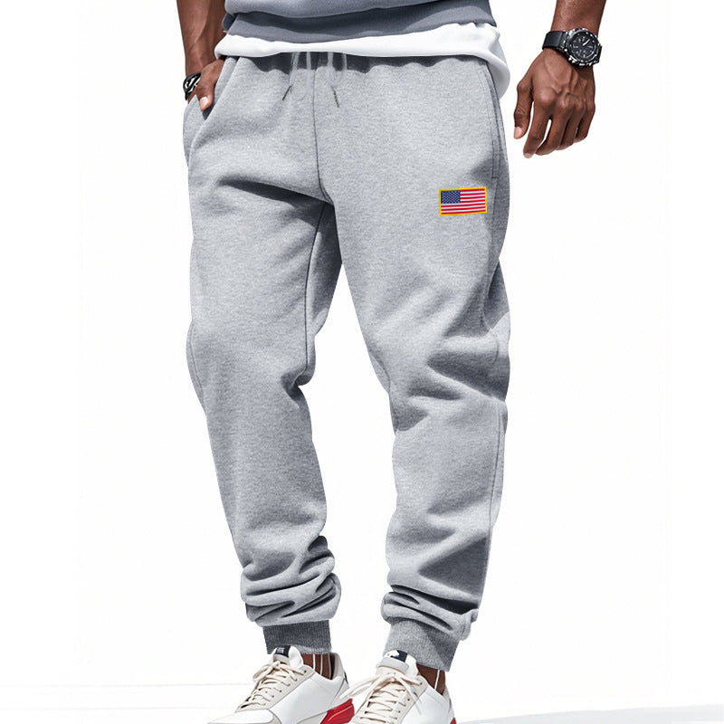 Men's slim-fit sweatpants with tapered leg, elastic drawstring waistband, and discreet flag application StylebySassy