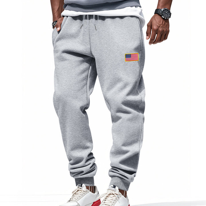 Men's slim-fit sweatpants with tapered leg, elastic drawstring waistband, and discreet flag application StylebySassy