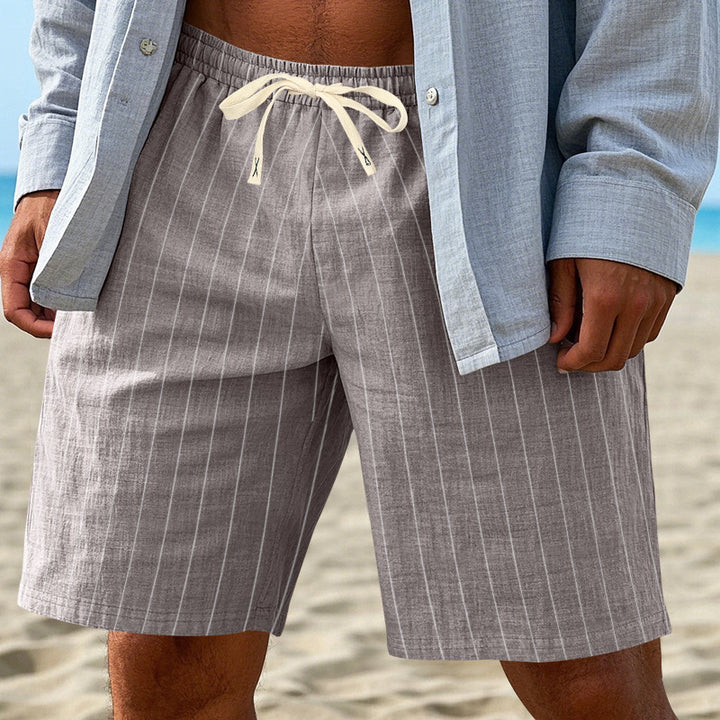 Men's relaxed beach Bermuda shorts with fine pinstripe structure, elastic drawstring waistband, and side slip pockets StylebySassy