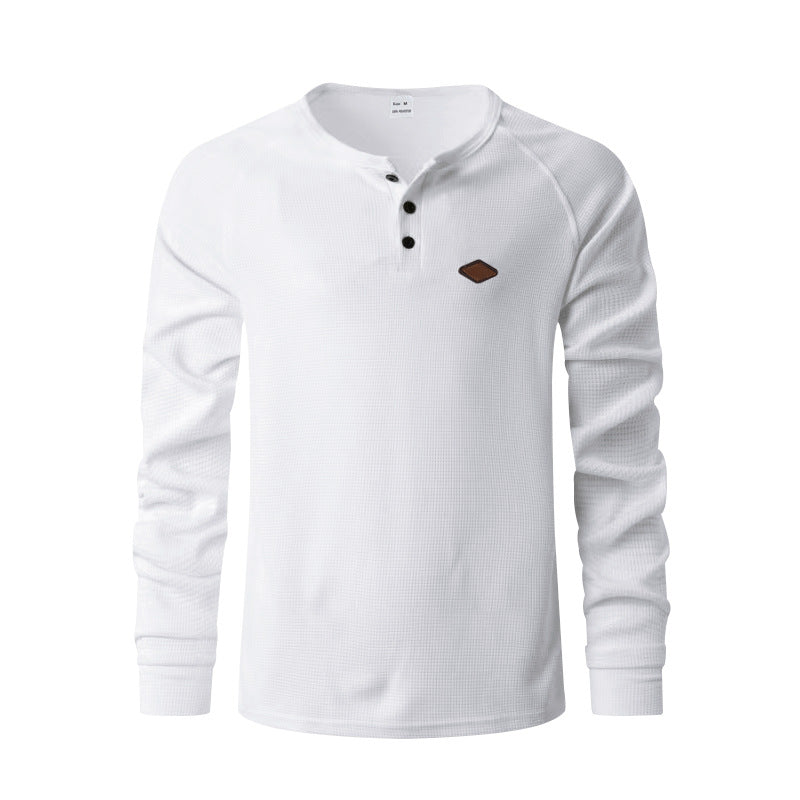 Men's structured long-sleeve shirt with short button placket, raglan sleeves, and subtle logo application StylebySassy