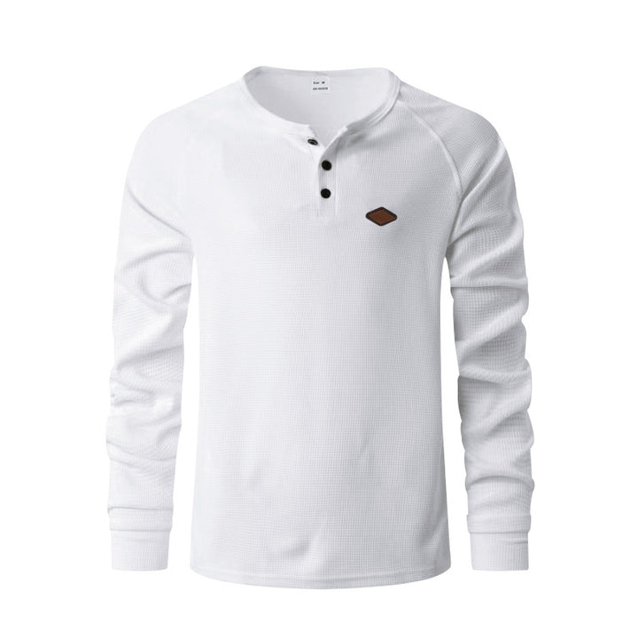 Men's structured long-sleeve shirt with short button placket, raglan sleeves, and subtle logo application StylebySassy