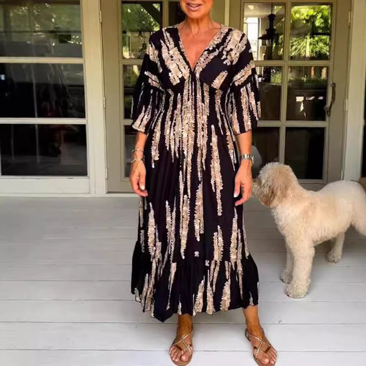 Ladies' V-neck maxi dress with brushstroke pattern, gathered underbust, balloon sleeves, and ruffled tiers StylebySassy