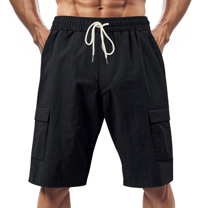 Men's technical cargo shorts with elastic drawstring waistband, secure flap pockets, and quick-drying functional material StylebySassy