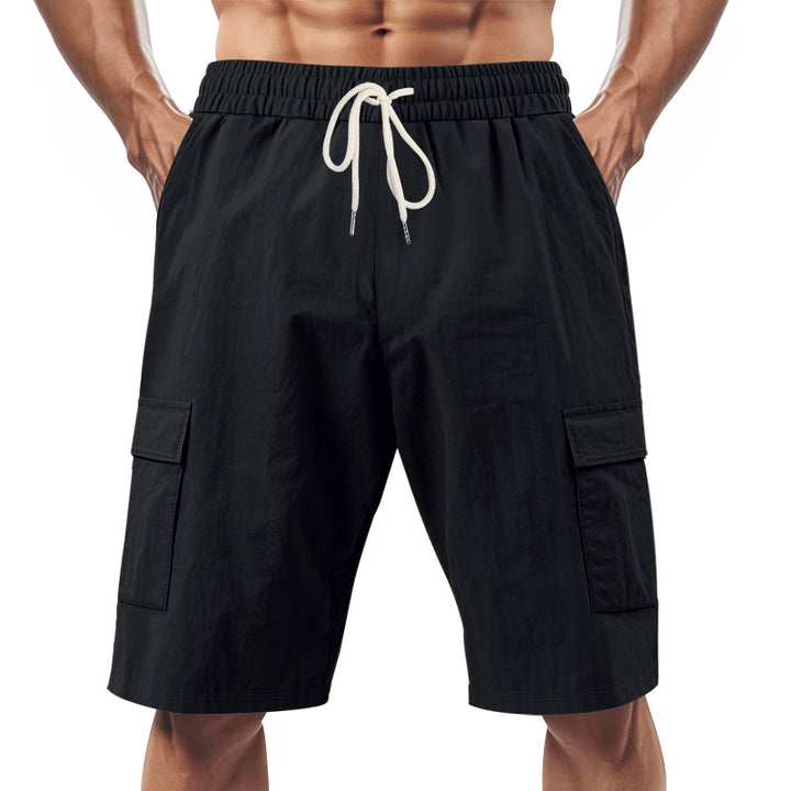 Men's technical cargo shorts with elastic drawstring waistband, secure flap pockets, and quick-drying functional material StylebySassy