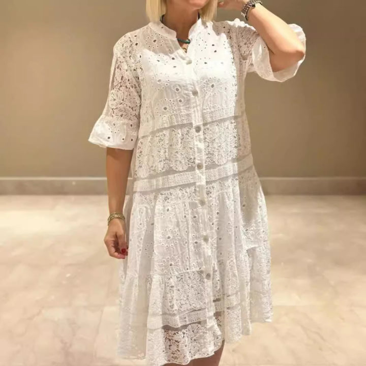 Women's romantic midi dress with broderie anglaise, buttoned top, stand-up collar, half-length flounce sleeves, and tiered hem StylebySassy