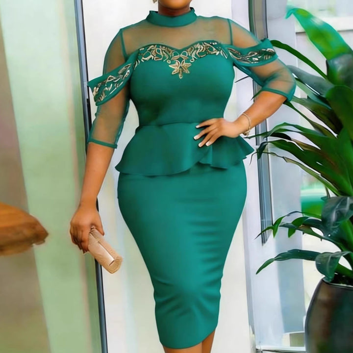 Women's fitted dress with transparent sleeves and sophisticated tulle overlay StylebySassy