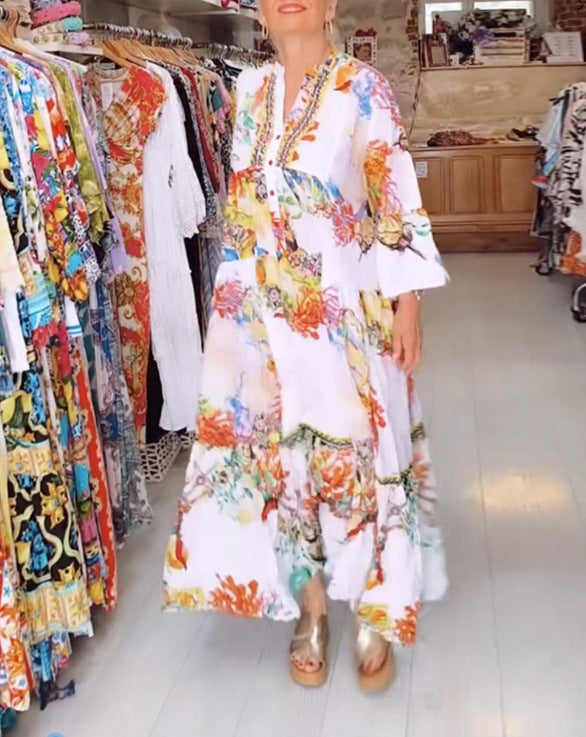 Women's airy maxi dress in layered look with V-neck, button placket, and three-quarter bell sleeves StylebySassy