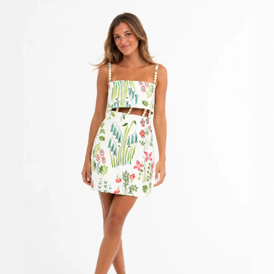 Women's two-piece summer set with pearl straps bandeau top and fitted mini skirt with waist cutout StylebySassy