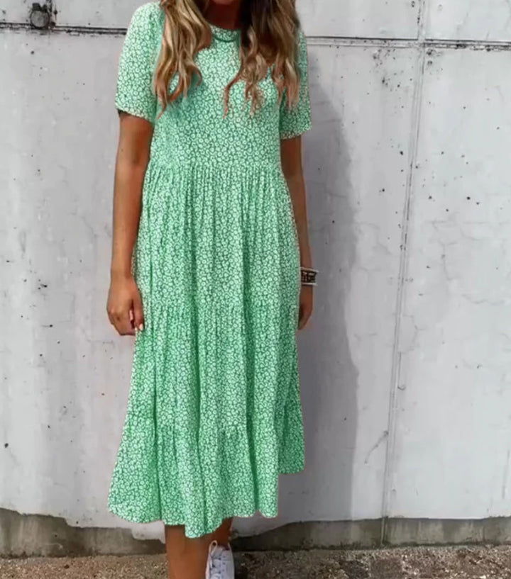 Women's floral crinkled midi dress with gathered empire waist, short sleeves, and tiered ruffle skirt StylebySassy