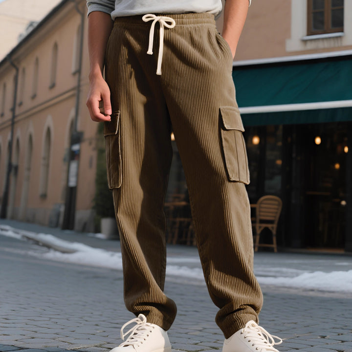 Men's casual utility cargo joggers with vertical ribbed structure, drawstring waistband, and large flap pockets StylebySassy
