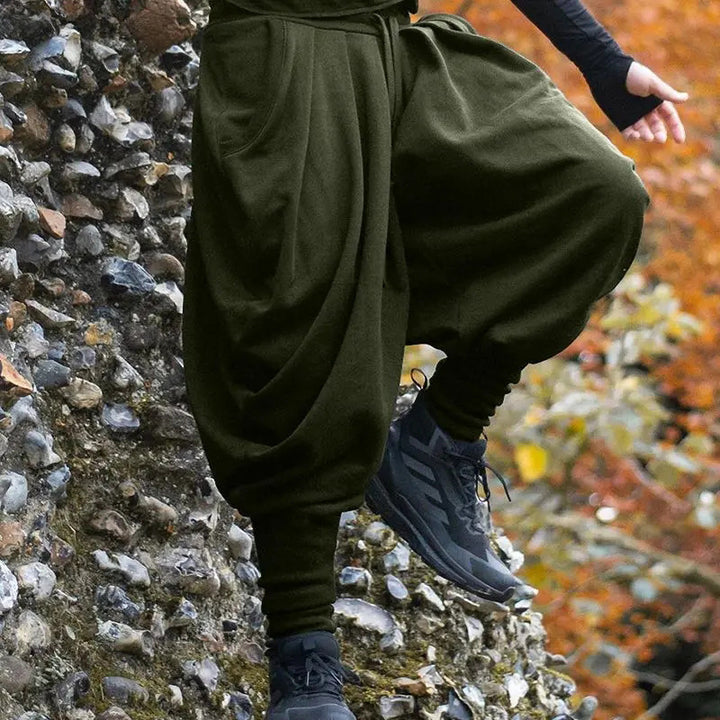 Men's avant-garde harem pants with wrap front, elastic waistband, and slim ankles StylebySassy