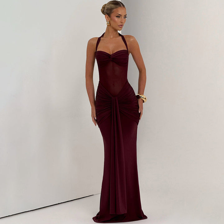 Women's figure-hugging halter evening dress with transparent mesh insert and gathered hip area StylebySassy