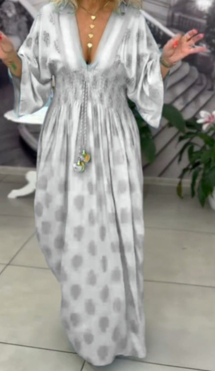 Women's gathered maxi dress with smocked waist, kimono sleeves, and decorative tassel StylebySassy