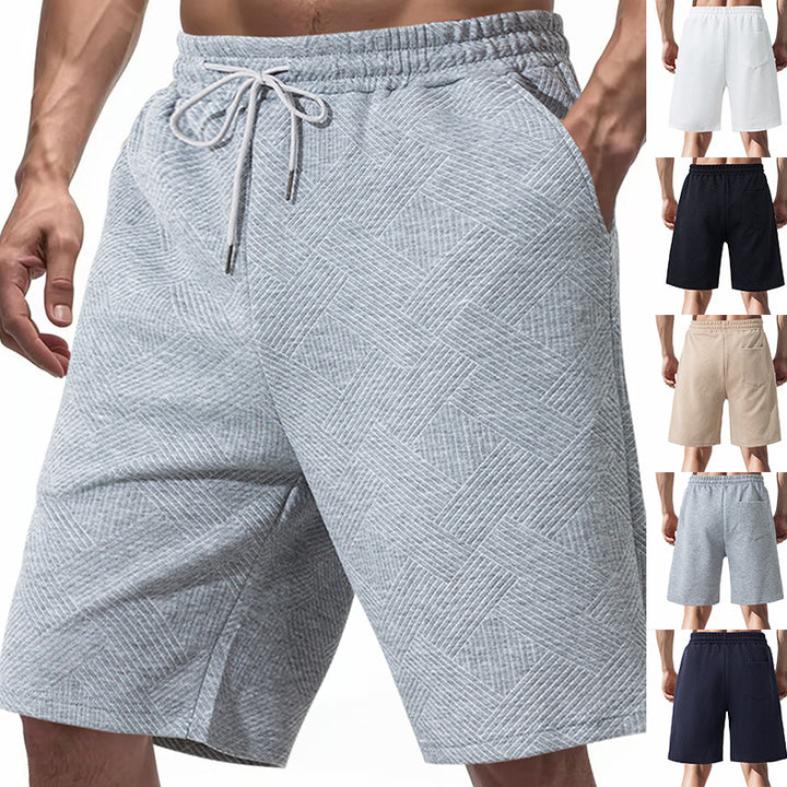 Men's knee-length textured swim shorts with elastic drawstring waistband and side pockets StylebySassy