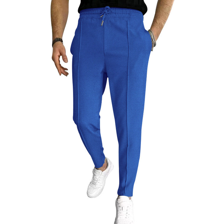 Men's tapered jogging chinos made of structured woven quality with elastic drawstring waistband and decorative crease StylebySassy