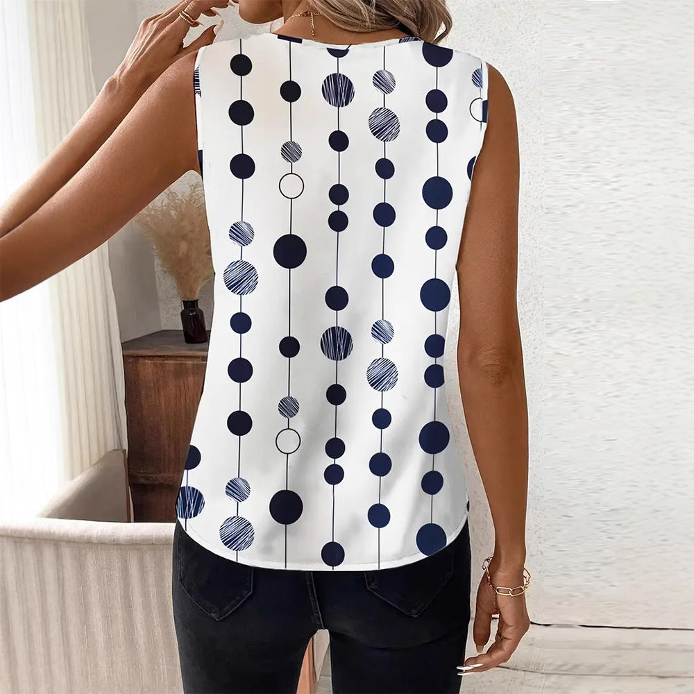 Women's V-neck blouse top with vertical polka dot pattern and subtle center seam StylebySassy