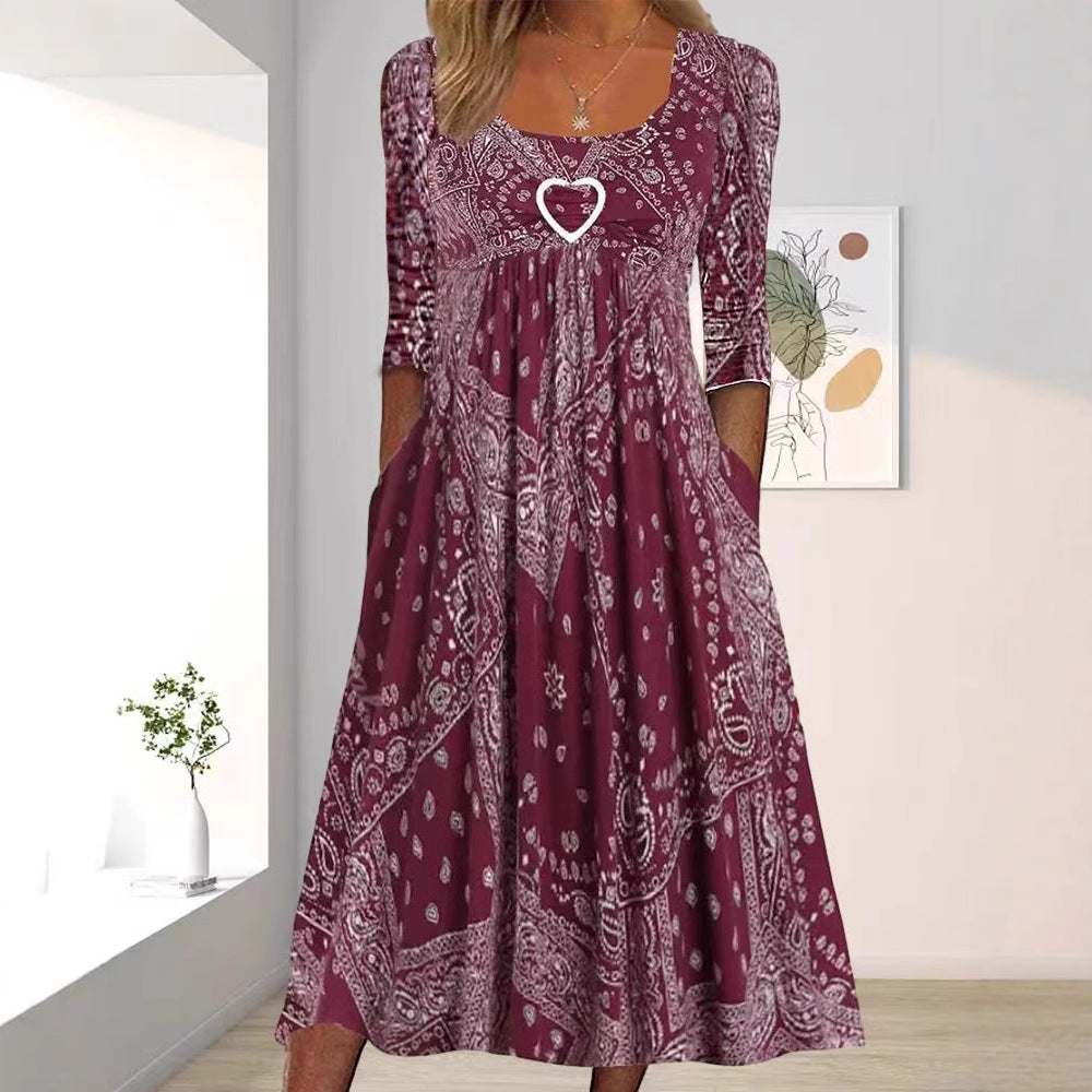 Women's maxi dress with paisley bandana pattern, empire seam, gathered underbust area, and side pockets StylebySassy