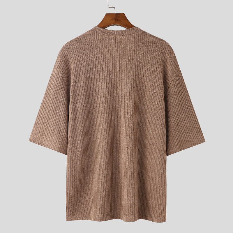 Women's oversized V-neck knit top with textured ribbed look and half-length sleeves StylebySassy