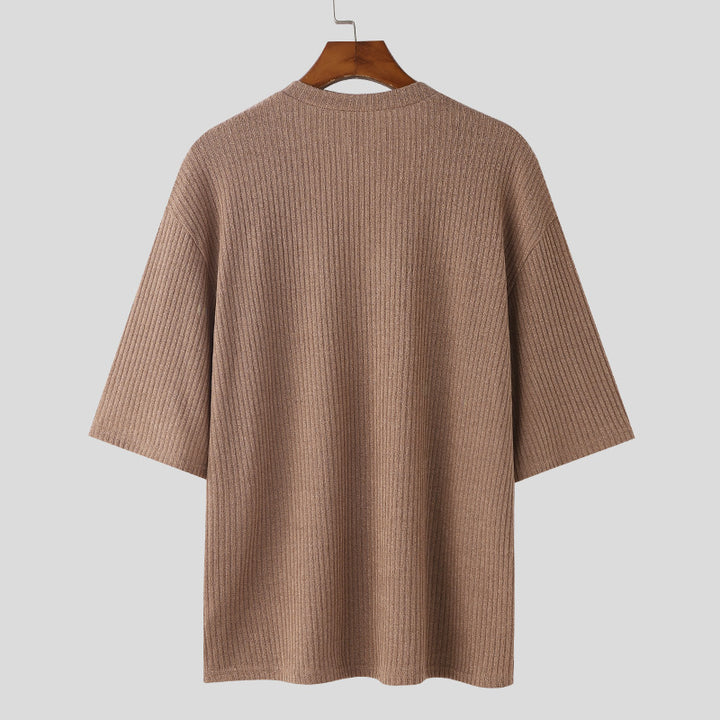 Women's oversized V-neck knit top with textured ribbed look and half-length sleeves StylebySassy