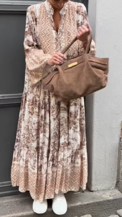 Ladies' tiered maxi dress with ethnic border, stand-up collar, and wide bell sleeves StylebySassy