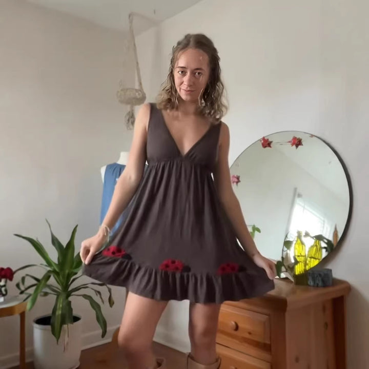 Women's short strap dress with deep V-neck, empire waist, and ladybug embroidery StylebySassy