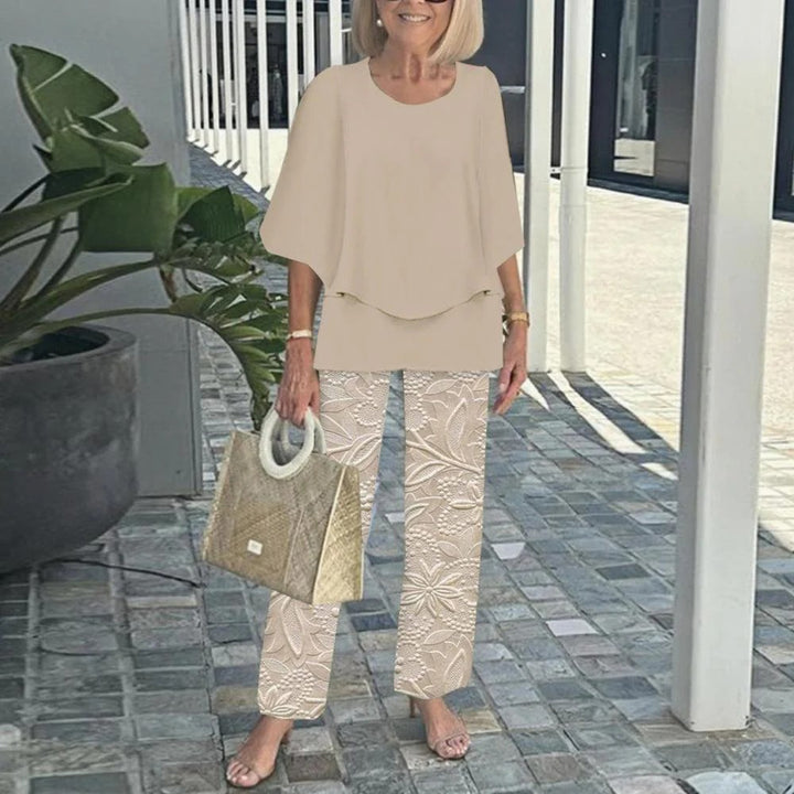 Women's layered tunic with cape sleeves and ankle-length straight leg pants with graphic print StylebySassy