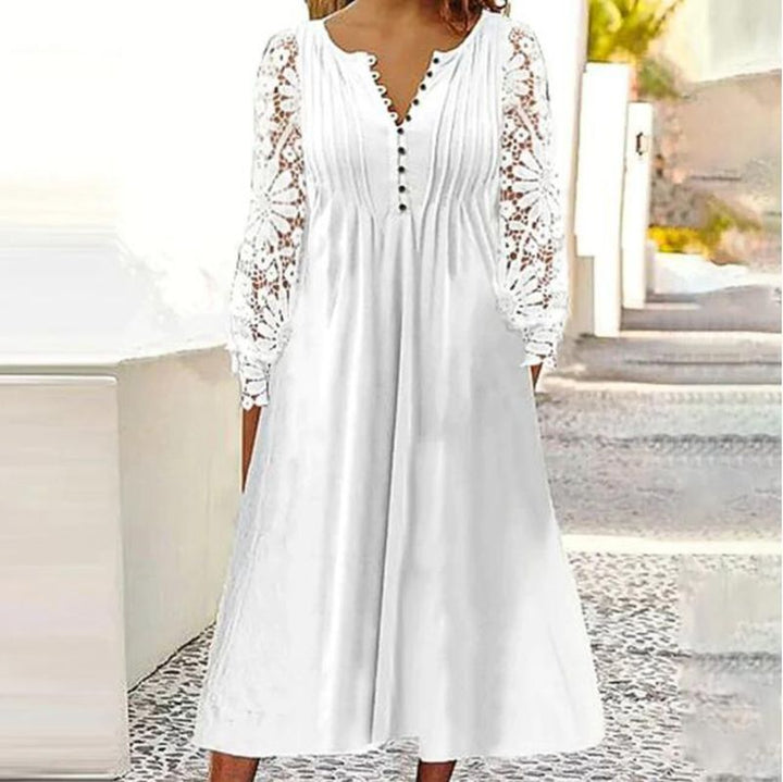 Ladies' knee-length A-line summer dress with crocheted long sleeves, pleated bodice and decorative button placket StylebySassy