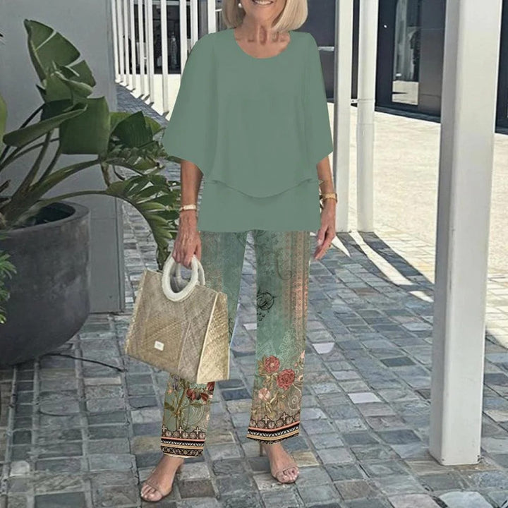 Women's layered tunic with cape sleeves and ankle-length straight leg pants with graphic print StylebySassy