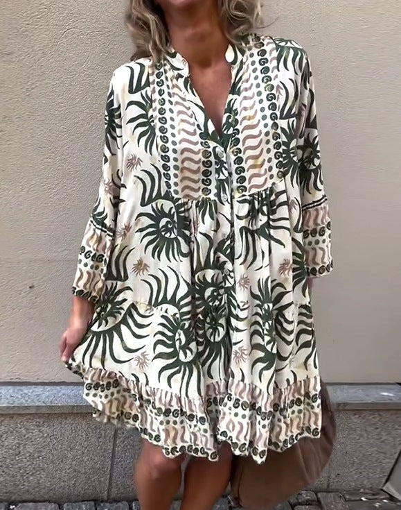 Women’s knee-length Boho tunic dress with V-neck, gathered empire seam, and ruffled hem StylebySassy