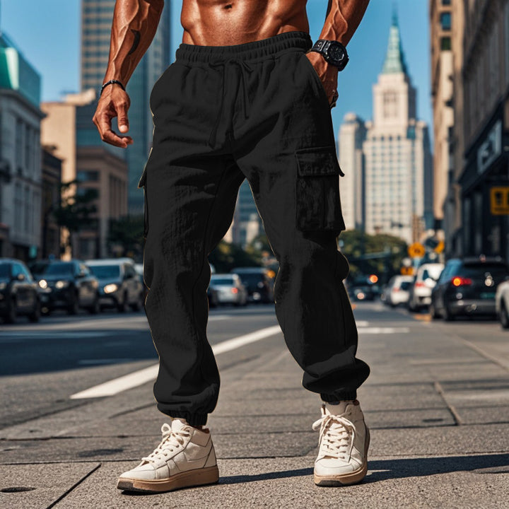 Men's sporty work-inspired joggers with patch flap pockets, elastic drawstring waistband, and gathered leg cuffs StylebySassy
