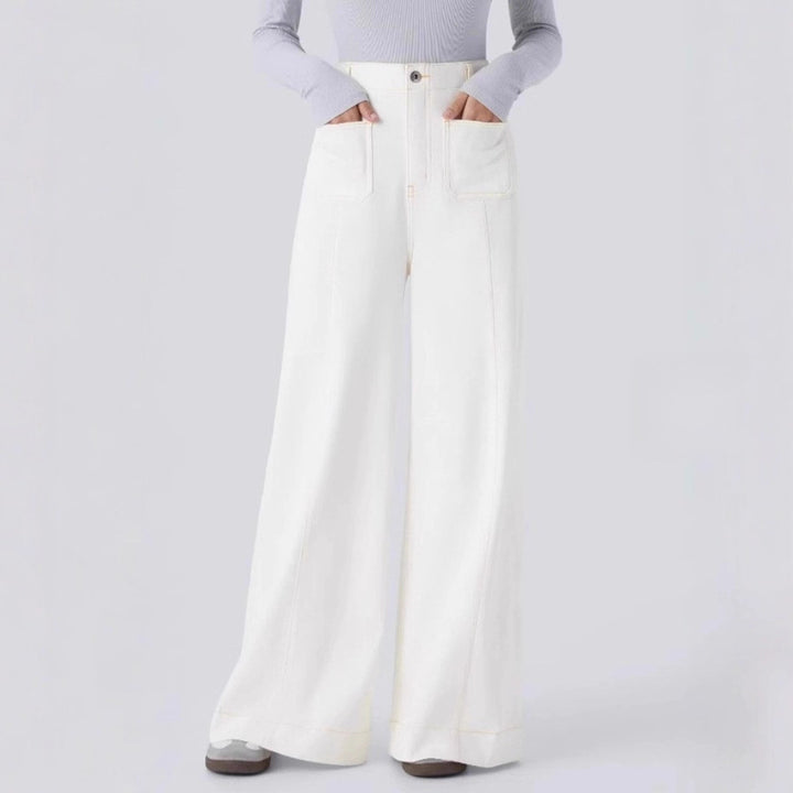 Women's high-waisted wide jeans pants with patch front pockets and vertical decorative seam StylebySassy