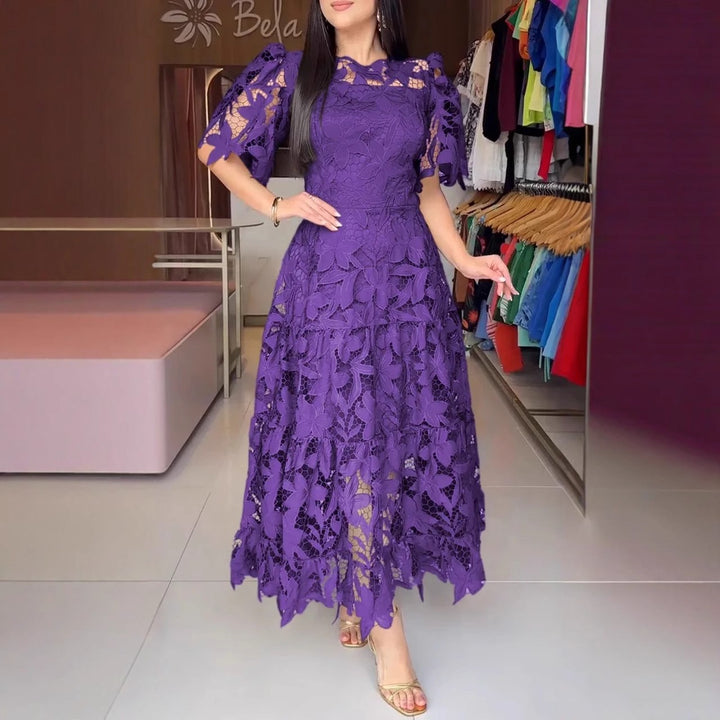 Women's maxi dress made of floral guipure lace with a fitted silhouette and tiered hem StylebySassy