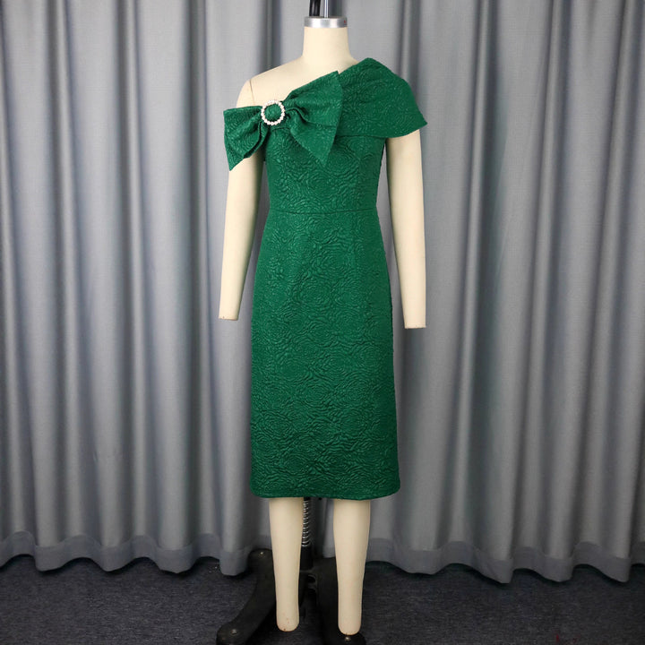 Ladies elegant cocktail dress with asymmetric strap and decorative bow detail StylebySassy