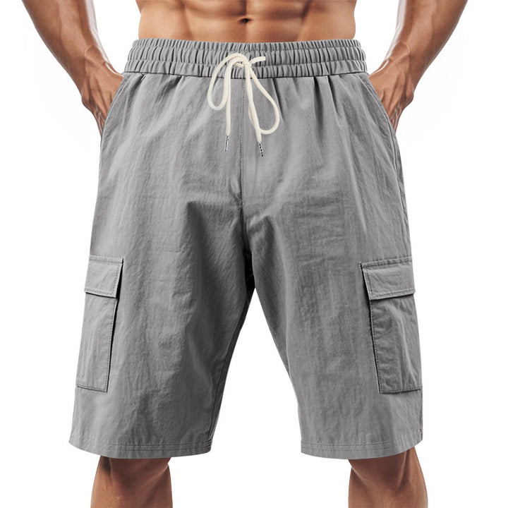 Men's technical cargo shorts with elastic drawstring waistband, secure flap pockets, and quick-drying functional material StylebySassy