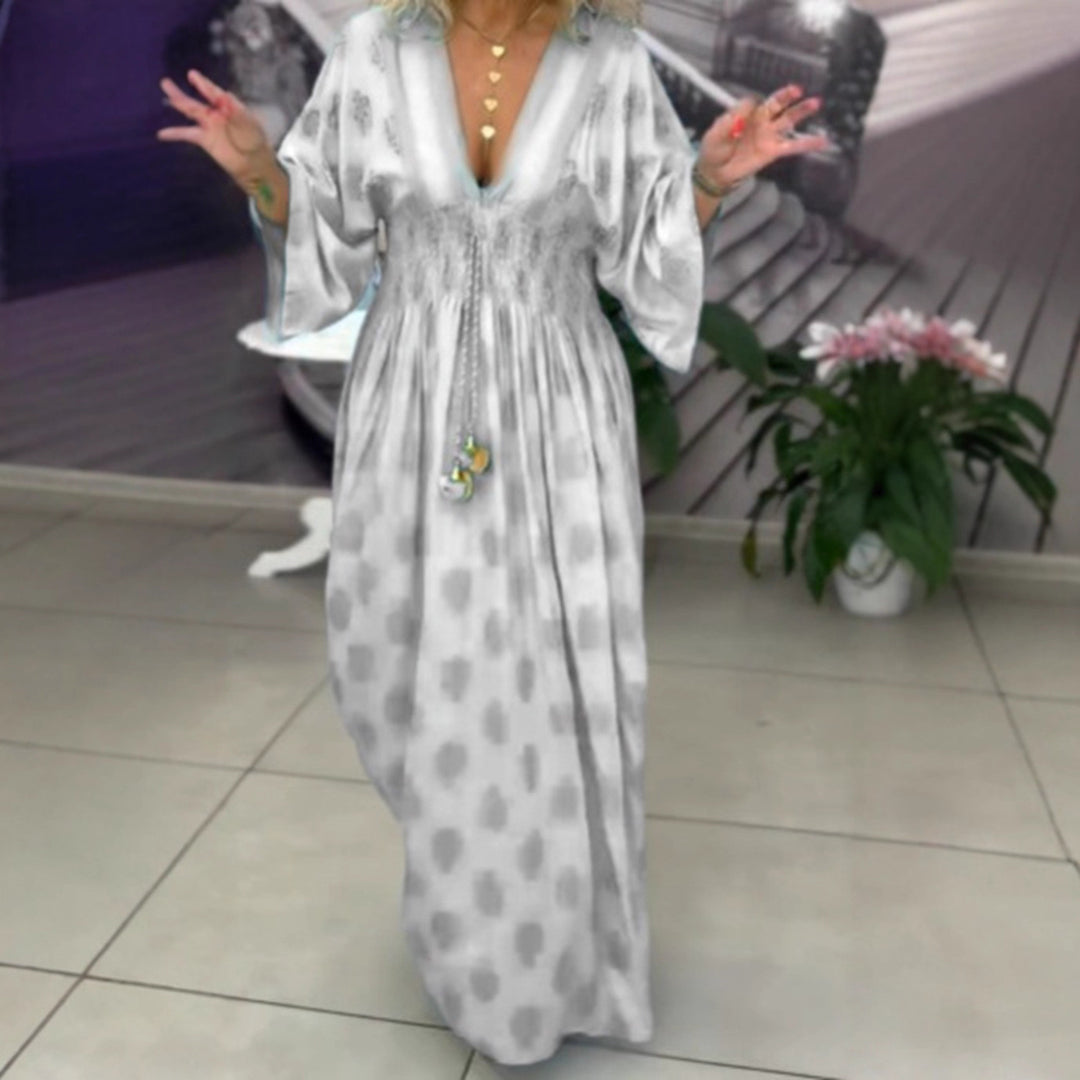 Women's gathered maxi dress with smocked waist, kimono sleeves, and decorative tassel StylebySassy