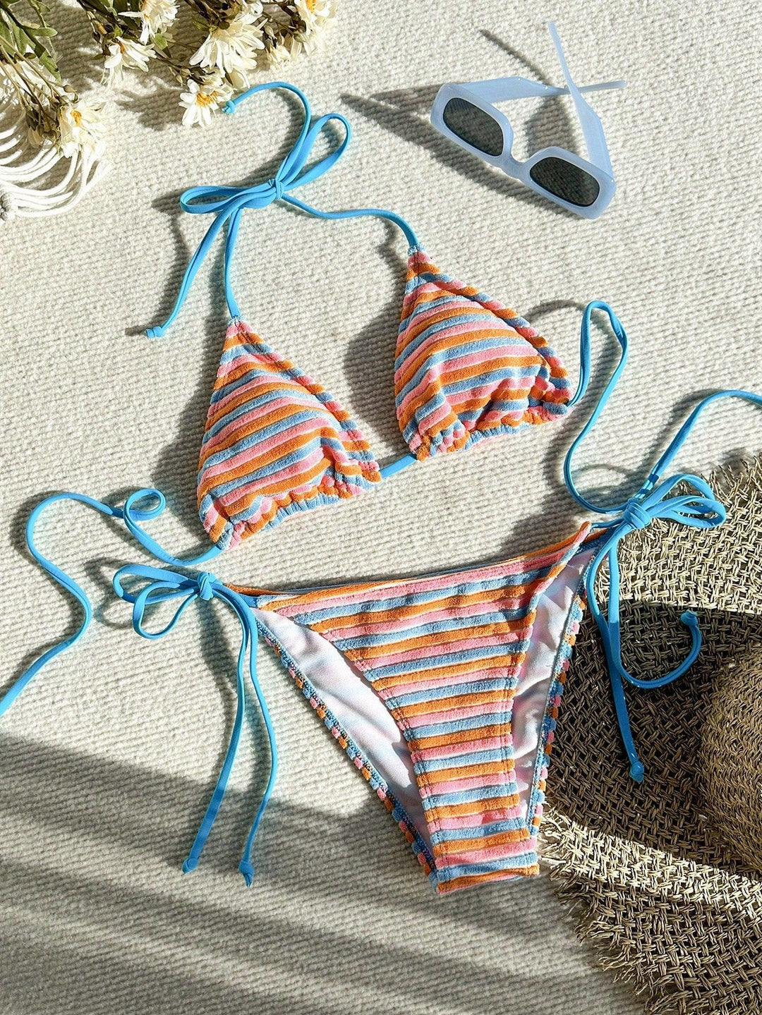 Women's bikini model with playful striped pattern StylebySassy
